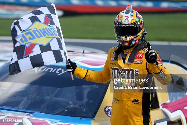 Kyle Busch, driver of the Twix Cookies & Creme Toyota, celebrates winning the NASCAR Xfinity Series Bariatric Solutions 300 at Texas Motor Speedway...