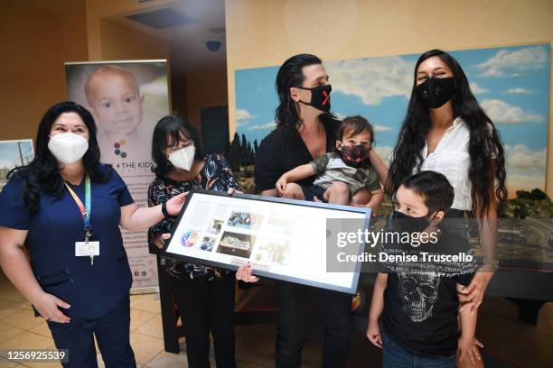 Dimitra Sarantakos , Criss Angel , his wife Shaunyl Benson with sons Johnny Crisstopher Sarantakos and Xristos Yanni Sarantakos attend the unveiling...