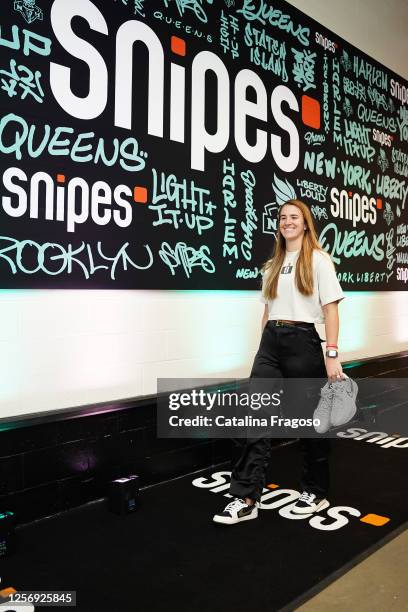 Sabrina Ionescu of the New York Liberty arrives to the arena holding the Nike Sabrina 1 in "Ionic" colorway before the game against the Indiana Fever...