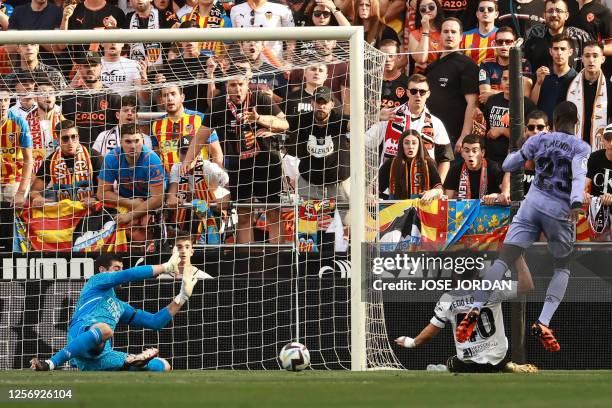 Valencia's Spanish forward Diego Lopez scores the opening goal during the Spanish league football match between Valencia CF and Real Madrid CF at the...