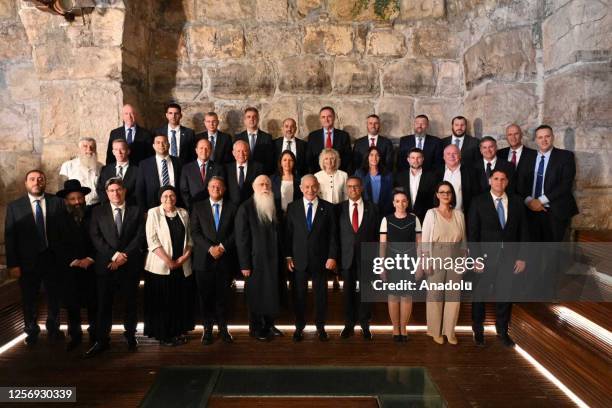 Israel's Prime Minister Benjamin Netanyahu takes part in a family photo at the weekly cabinet meeting, inside the Western Wall [Al-Buraq Wall]...