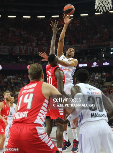 Real Madrid's Walter TavaReal jumps to through the ball past Olympiacos' Moustapha Fall during the Euroleague basketball final four final match...