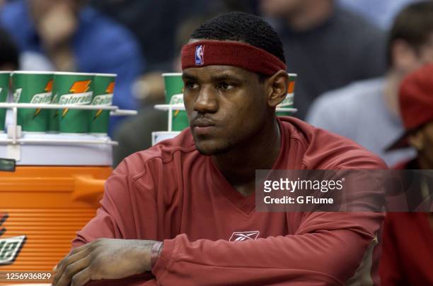LeBron James of the Cleveland Cavaliers sits on the bench during the game against the Washington Wizards on November 19, 2003 at the MCI Center in...