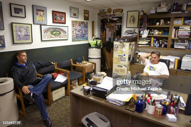 Portrait of Oakland Athletics general manager Billy Beane and Boston Red Sox general manager Theo Epstein sitting in Beane's office before game at...