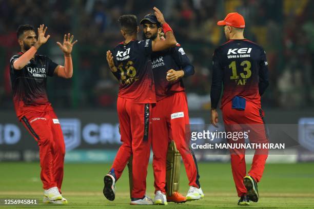Royal Challengers Bangalore's players celebrate after the dismissal of Gujarat Titans' Dasun Shanaka during the Indian Premier League Twenty20...