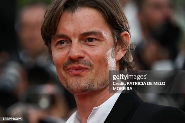 British actor Sam Riley arrives for the screening of the film "Firebrand" during the 76th edition of the Cannes Film Festival in Cannes, southern...
