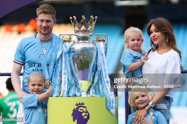 Kevin De Bruyne of Manchester City celebrates with his wife, Michele Lacroix and family during the Premier League match between Manchester City and...