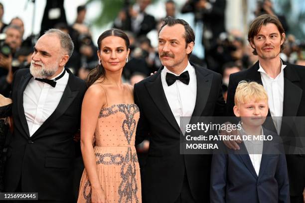 Brazilian director Karim Ainouz, Swedish actress Alicia Vikander, British actor Jude Law, a guest and British actor Sam Riley arrive for the...