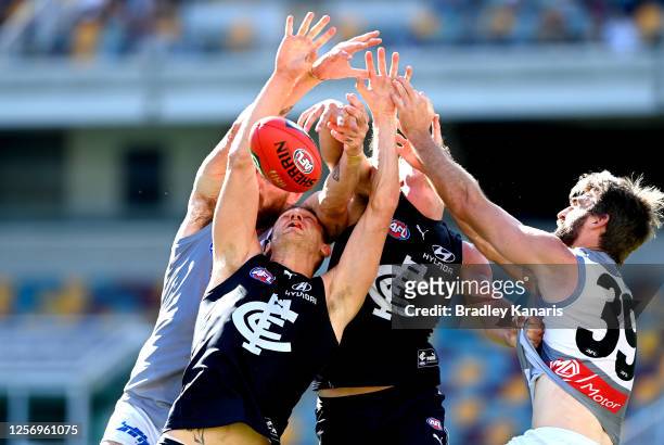 Liam Jones of Carlton and Justin Westhoff of Port Adelaide challenge for the ball during the round 7 AFL match between the Carlton Blues and the Port...