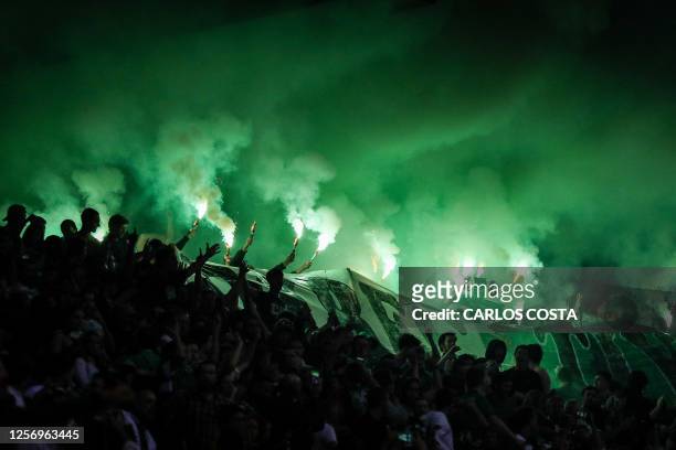 Sporting supporters light up flares during during the Portuguese league football match between Sporting CP and SL Benfica at the Jose Alvalade...