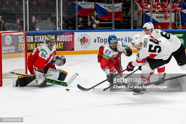 Christian Marti of Switzerland tries to score against goalkeeper Marek Langhamer of Czech Republic during the 2023 IIHF Ice Hockey World Championship...