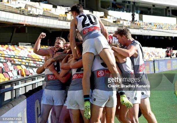 Robbie Gray of Port Adelaide celebrates victory with his team mates after kicking the match winning goal during the round 7 AFL match between the...