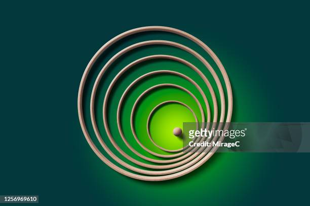 sphere surrounded by rings - stuck inside fotografías e imágenes de stock