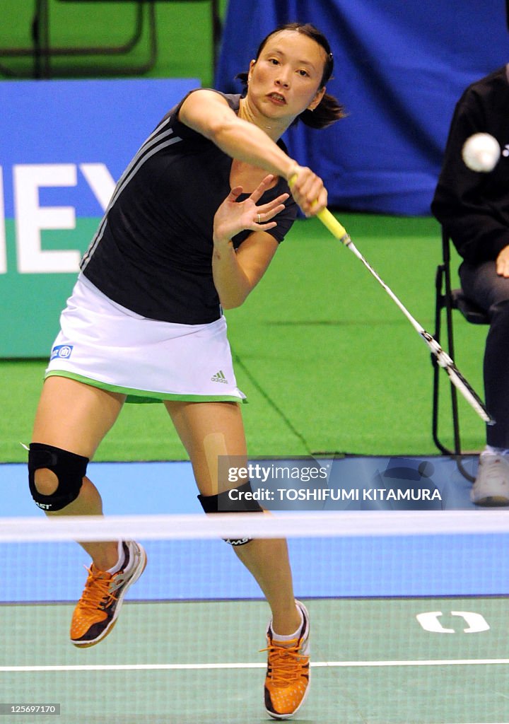 Pi Hongyan Pi Hongyan of France returns the shuttlecock towards third-seeded ...