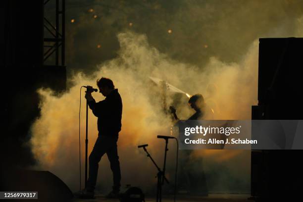 Pasadena, CA Echo & The Bunnymen singer Ian Stephen McCulloch is silhouetted by smoke while performing at sunset on the Outsiders stage at Cruel...