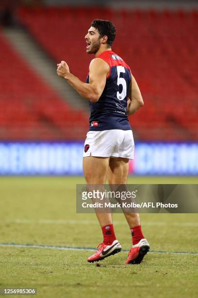 Christian Petracca of the Demons celebrates kicking a goal during the round 7 AFL match between the Hawthorn Hawks and the Melbourne Demons at GIANTS...