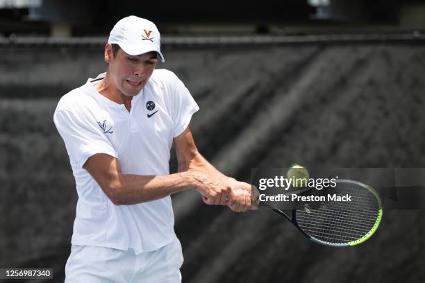 Virginia's Chris Rodesh hits a backhand during his match in the Division I Men's Tennis Championships held at the USTA National Campus on May 21,...