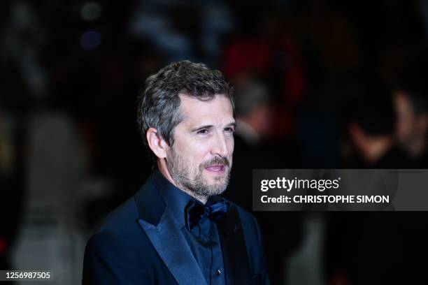 French actor Guillaume Canet arrives for the screening of the film "Acide" during the 76th edition of the Cannes Film Festival in Cannes, southern...