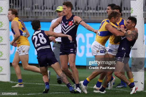 Brad Sheppard of the Eagles and Michael Walters of the Dockers wrestle during the round 7 AFL match between the Fremantle Dockers and the West Coast...