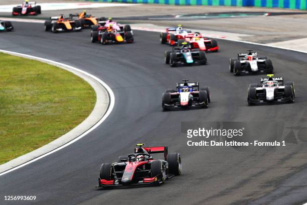 Callum Ilott of Great Britain and UNI-Virtuosi Racing leads Luca Ghiotto of Italy and Hitech Grand Prix and the rest of the field at the start during...