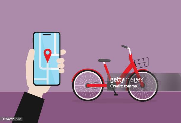 geschäftsmann halten ein handy für die nutzung eines fahrrad-sharing - bicycle rental stock-grafiken, -clipart, -cartoons und -symbole