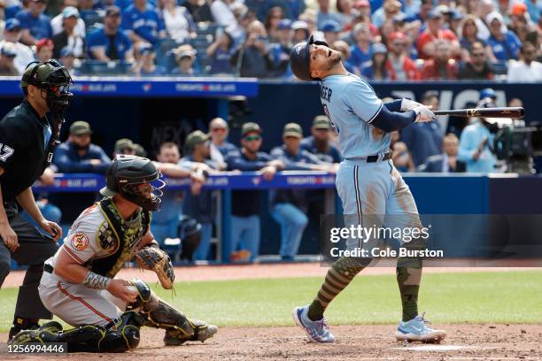George Springer of the Toronto Blue Jays strikes out swinging in the ninth inning of their MLB game against the Baltimore Orioles at Rogers Centre on...
