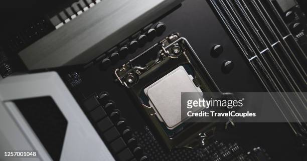 installation cpu on socket of motherboard - computer repair background stock pictures, royalty-free photos & images