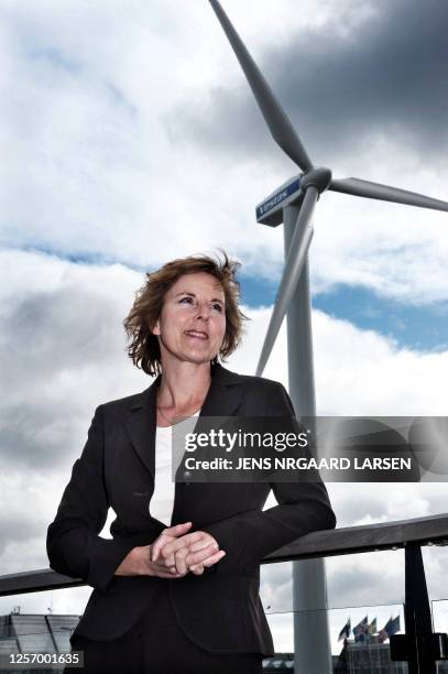 Denmark's Minister for Climate and Energy, Connie Hedegaard stands in front of a wind turbine at Bella Center in Copenhagen where the Climate Change...