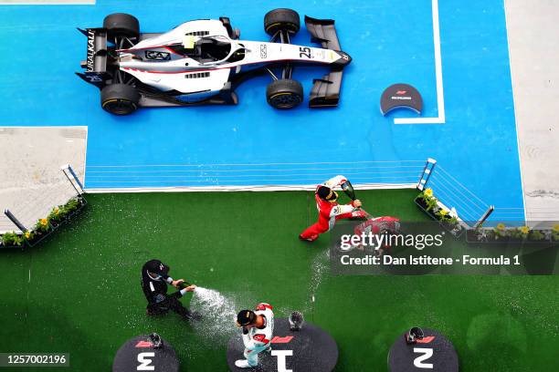 Race winner Luca Ghiotto of Italy and Hitech Grand Prix celebrates on the podium with second placed Callum Ilott of Great Britain and UNI-Virtuosi...