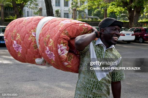 Charles Ble Goude, Gbagbo's fiery youth minister and leader of the militant "Young Patriots" arrives with his matelas to sepnd the night with several...