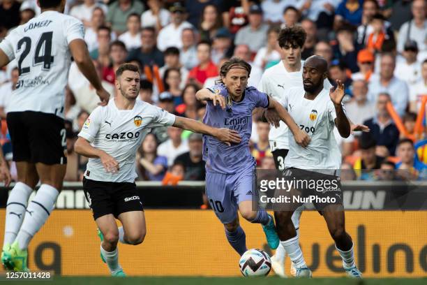 Toni Lato of Valencia CF Luca Modric of Real Madrid and Dimitri Foulquier of Valencia CF during La Liga match between Valencia CF and Real Madrid at...