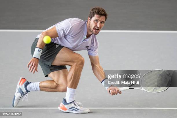 Mischa Zverev of Germany returns the ball to Roberto Bautista Agut of Spain of during day 6 of the tennis tournament bett1ACES at Hangar 6 of the...