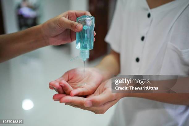 hand of lady that applying alcohol gel or anti bacteria soap to make cleaning - helicobacter pylori stock-fotos und bilder