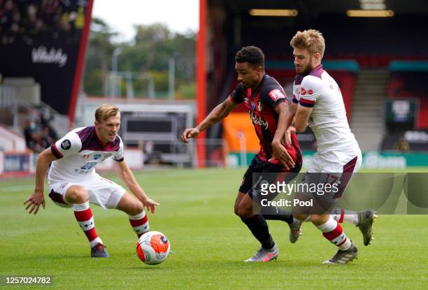 James Ward-Prowse of Southampton and Stuart Armstrong of Southampton battles for possession with Junior Stanislas of AFC Bournemouth during the...