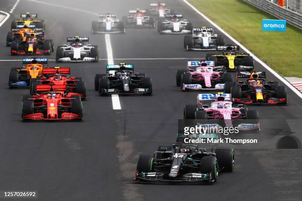 Lewis Hamilton of Great Britain driving the Mercedes AMG Petronas F1 Team Mercedes W11 leads at the start of the race into the first corner during...