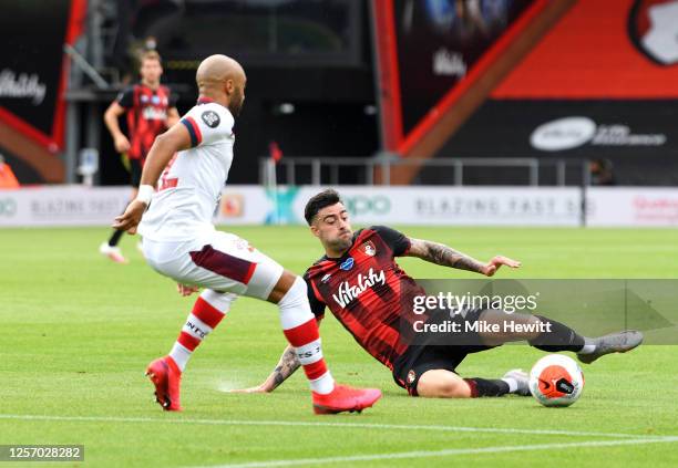 Diego Rico of AFC Bournemouth tackles Nathan Redmond of Southampton during the Premier League match between AFC Bournemouth and Southampton FC at...