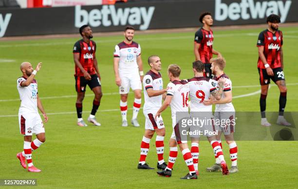 Danny Ings of Southampton celebrates with his team after scoring his sides first goal during the Premier League match between AFC Bournemouth and...