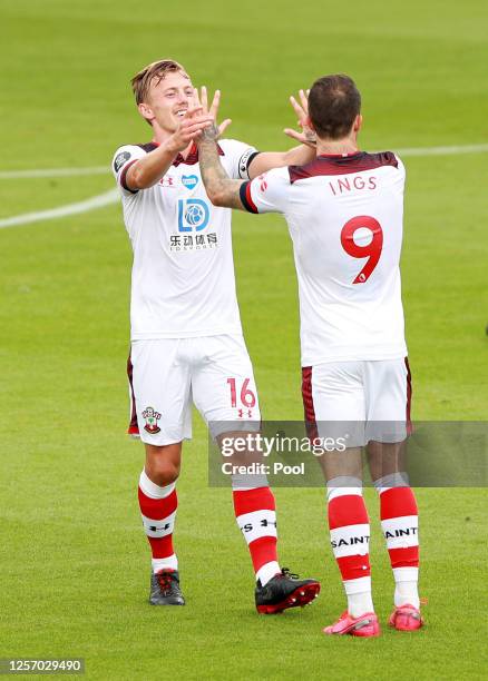 Danny Ings of Southampton celebrates with his team after scoring his sides first goal during the Premier League match between AFC Bournemouth and...