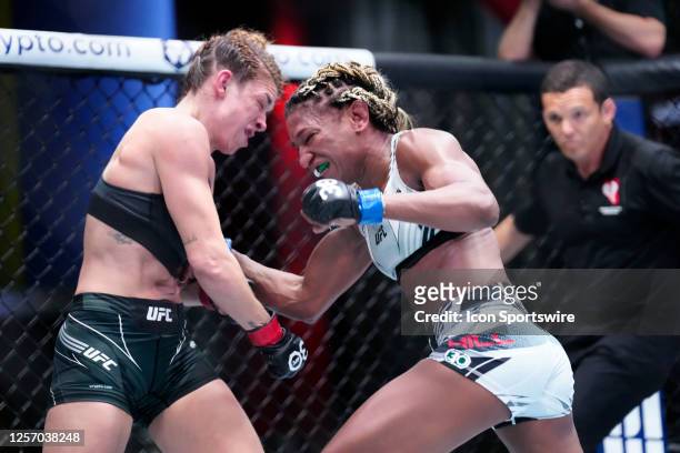 Angela Hill punches Mackenzie Dern in their Women's Strawweight bout during the UFC Vegas 73 event at UFC Apex on May 20 in Las Vegas, NV.