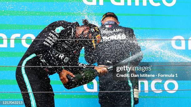 Race winner Lewis Hamilton of Great Britain and Mercedes GP celebrates on the podium during the Formula One Grand Prix of Hungary at Hungaroring on...