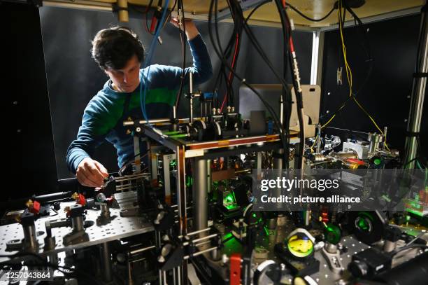 May 2023, Baden-Württemberg, Stuttgart: Florian Meinert, group leader at the 5th Institute of Physics at the University of Stuttgart, adjusts a...