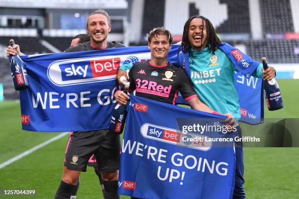 Ezgjan Alioski of Leeds United celebrates with his team after winning the league and promotion to the premier league during the Sky Bet Championship...