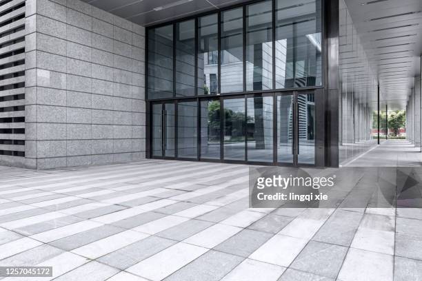 facade of a building in a business district in hangzhou, china - modern office building entrance stock pictures, royalty-free photos & images