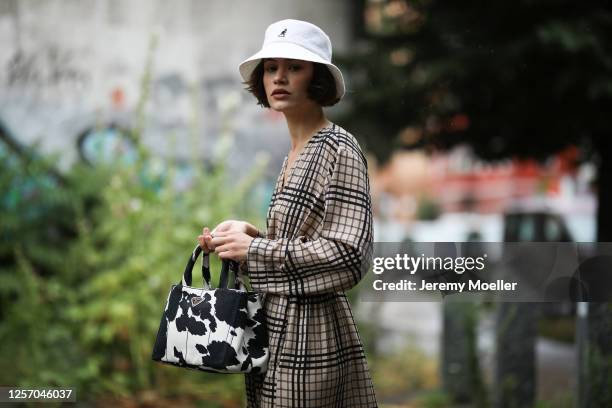 Lea Neumann wearing Prada bag, Weekday dress and Kangol bucket hat on July 15, 2020 in Berlin, Germany.