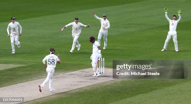 Sam Curran of England celebrates taking the wicket of Shai Hope of West Indies caught by Jos Buttler of England with Zak Crawley , Ben Stokes and Joe...