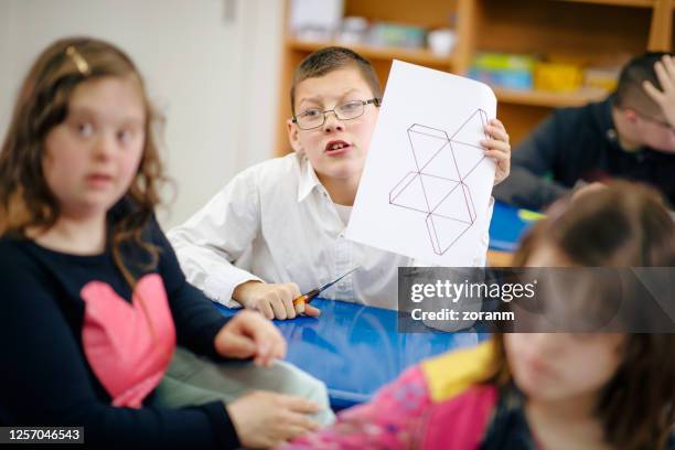 group of special needs children at class - weakness stock pictures, royalty-free photos & images