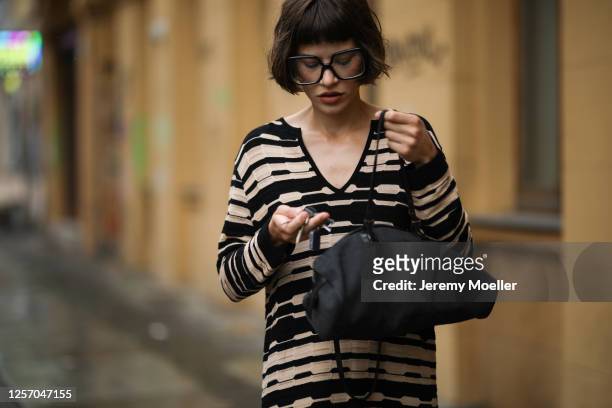 Lea Neumann wearing Fendi Baguette bag, Missoni dress and vintage glasses on July 15, 2020 in Berlin, Germany.