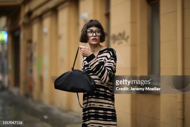 Lea Neumann wearing Fendi Baguette bag, Missoni dress and vintage glasses on July 15, 2020 in Berlin, Germany.