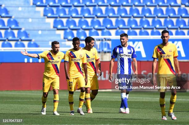 Ansu Fati of FC Barcelona is congratulated by his teammate Jordi Alba after scoring his sides first goal during the Liga match between Deportivo...