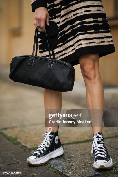 Lea Neumann wearing Fendi Baguette bag, Converse chucks and Missoni dress on July 15, 2020 in Berlin, Germany.